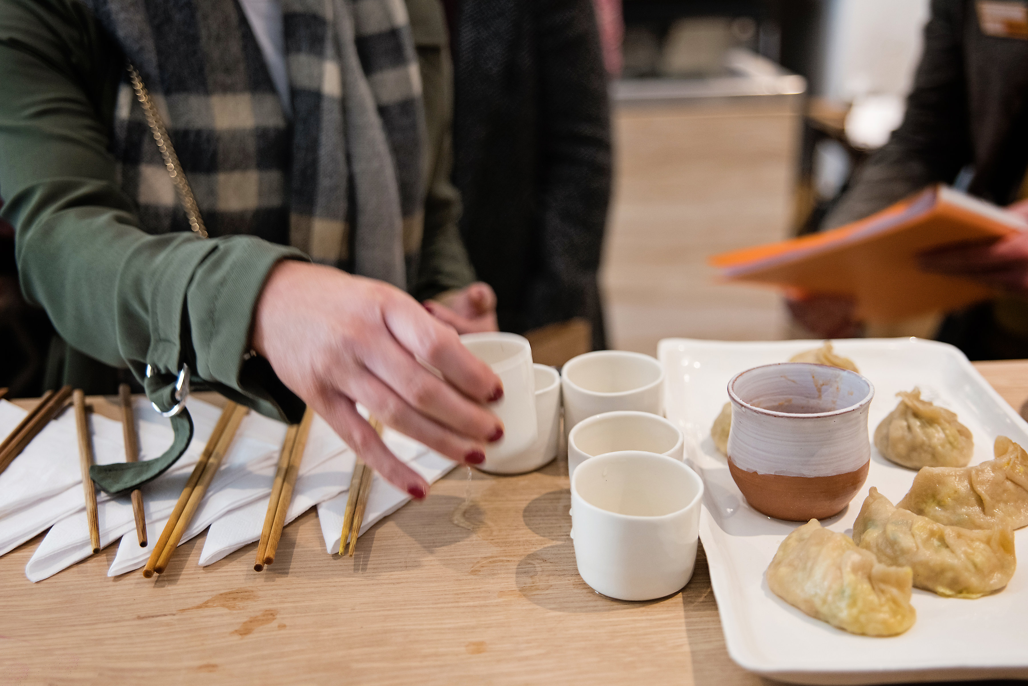 Cups of tea and Japanese gyoza being served at a restaurant in Bath