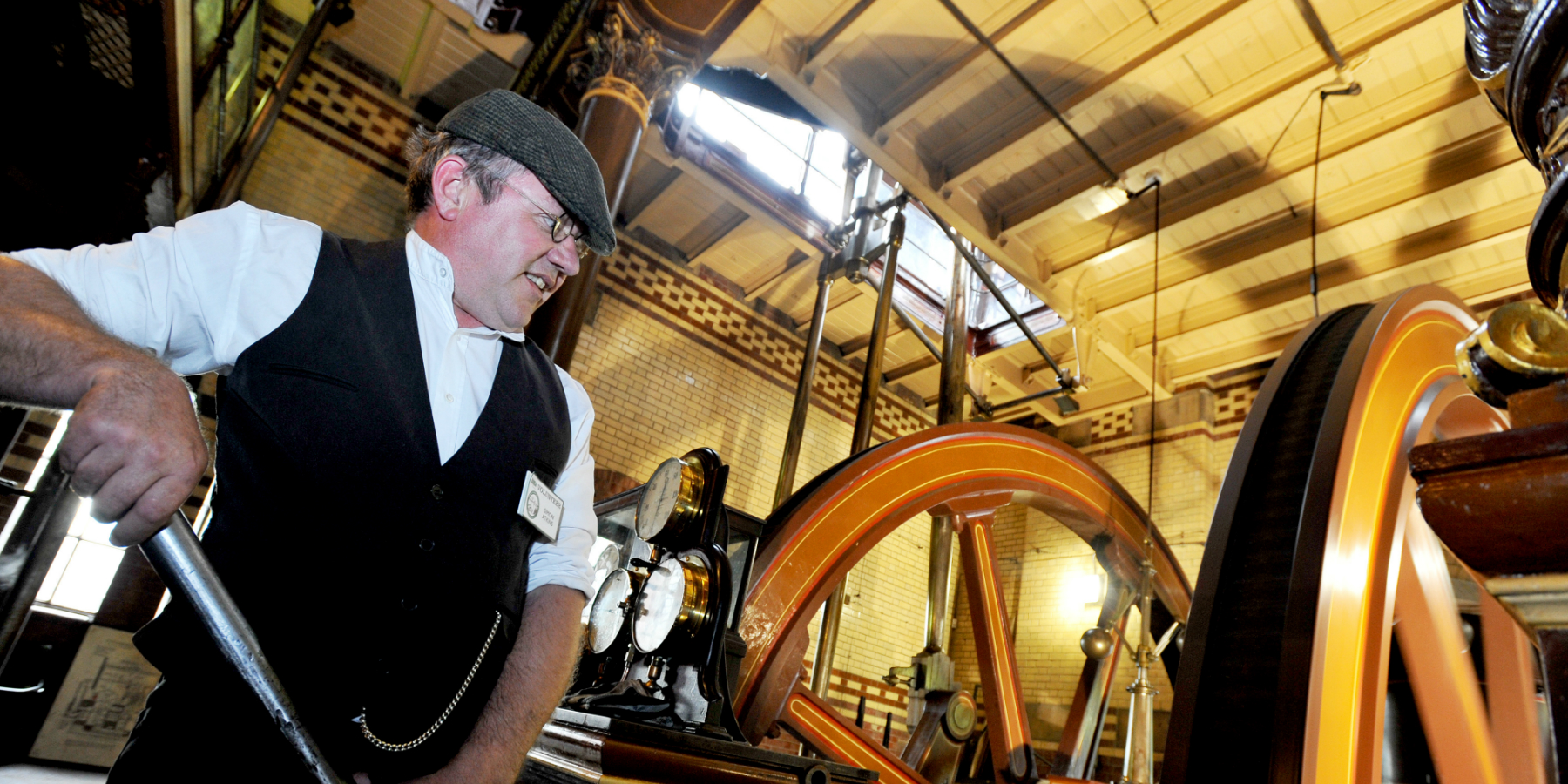 A man demonstrating machinery at Abbey Pumping Station in Leicester