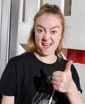 A lady with her thumbs up at Birmingham Comedy Festival (autumn)