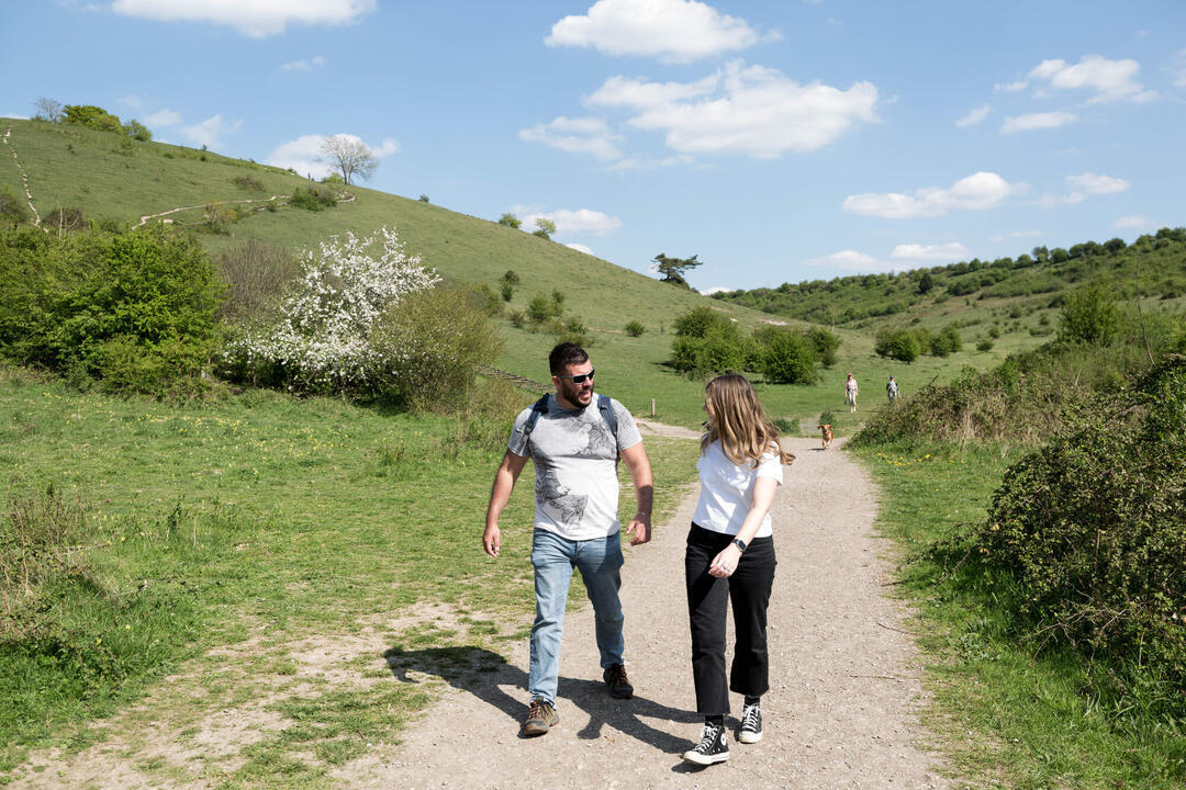 A man and woman walking along the National Trust Black Down