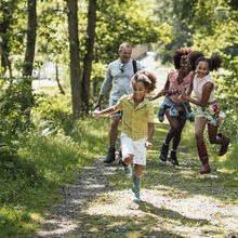 A shot of a family walking in the countryside.