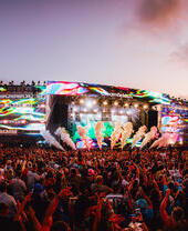 Crowd in front of the main stage at a music festival