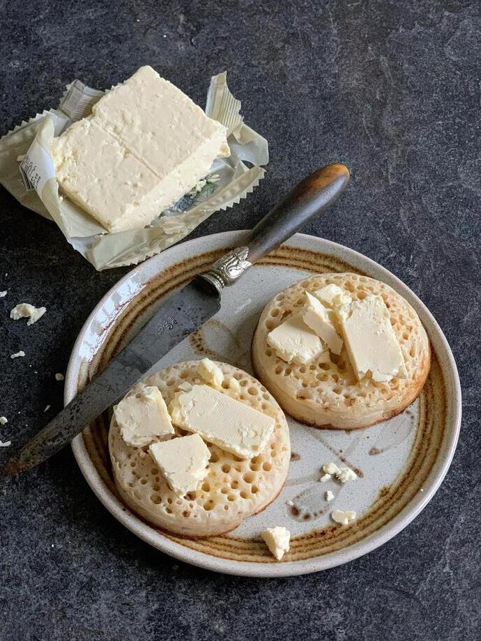 Caerphilly cheese on crumpets, served on a plate