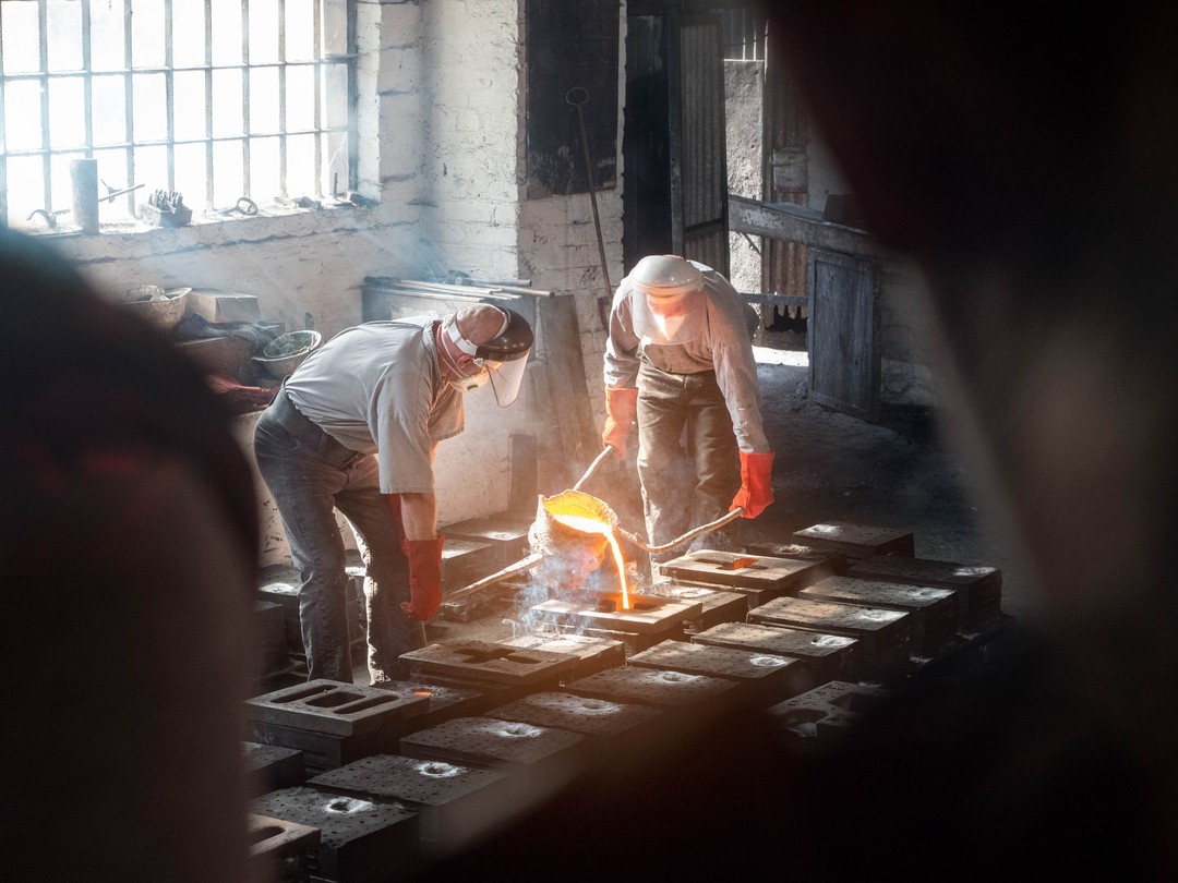 A group of workers pouring steel at Ironbridge Gorge, one of the starting places of the Industrial Revolution