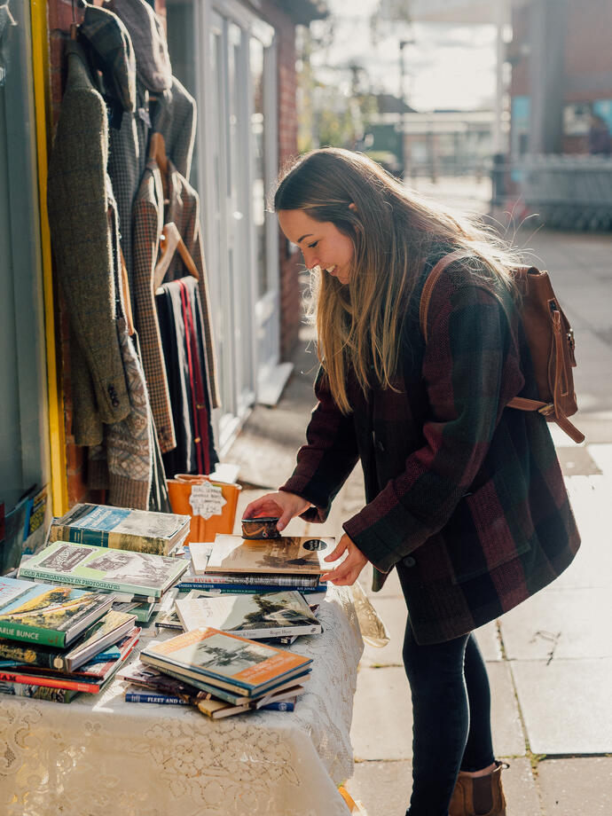 Woman browsing a vintage stall