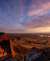 Hen Cloud and Tittesworth Reservoir from the Roaches at sunset. Peak District sandstone and the Staffordshire moorlands.