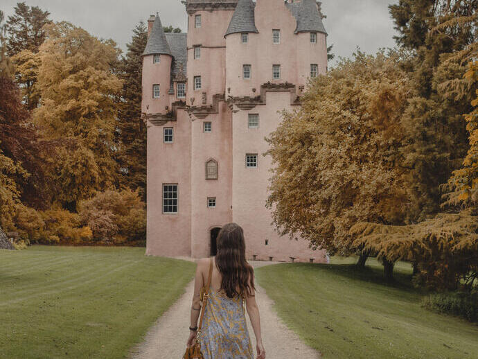 Woman walking towards a castle