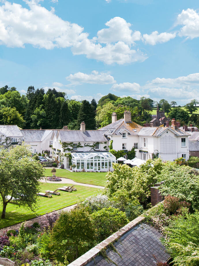 The view of the gardens and greenhouse at an upscale Country House Hotel & Restaurant