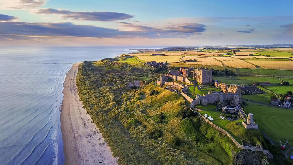 Aerial view of a large castle on the coast
