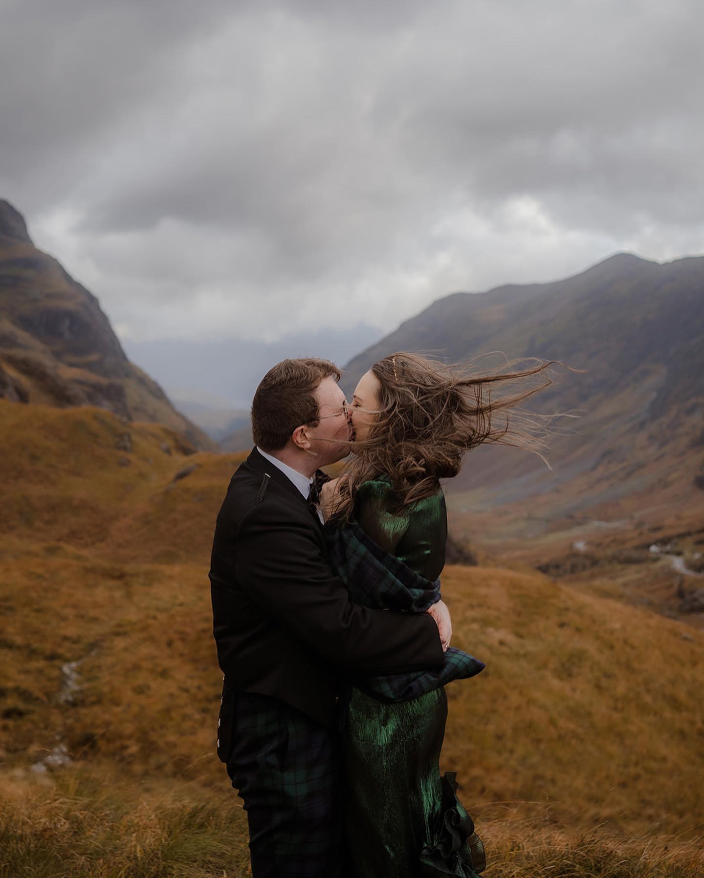 A couple embracing in Glencoe, Highlands, Scotland