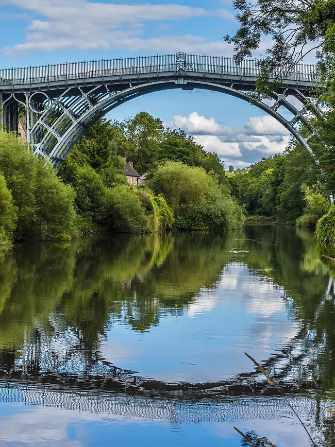 A lovely iron arched bridge over a pretty river