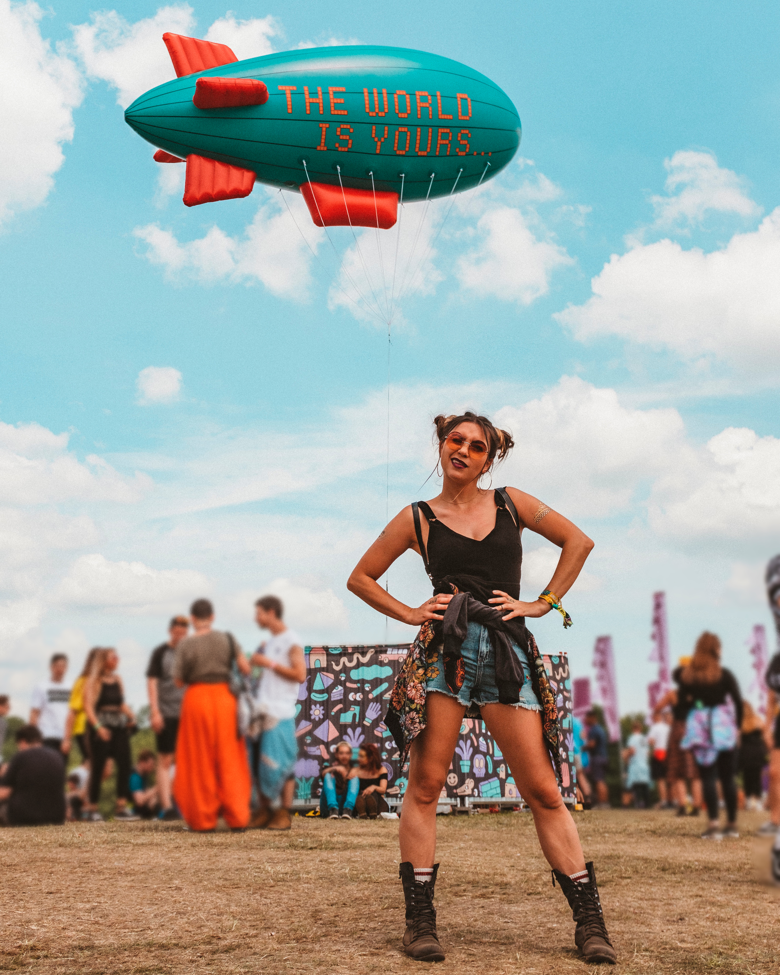 Woman standing with her hands on her hips at a music festival