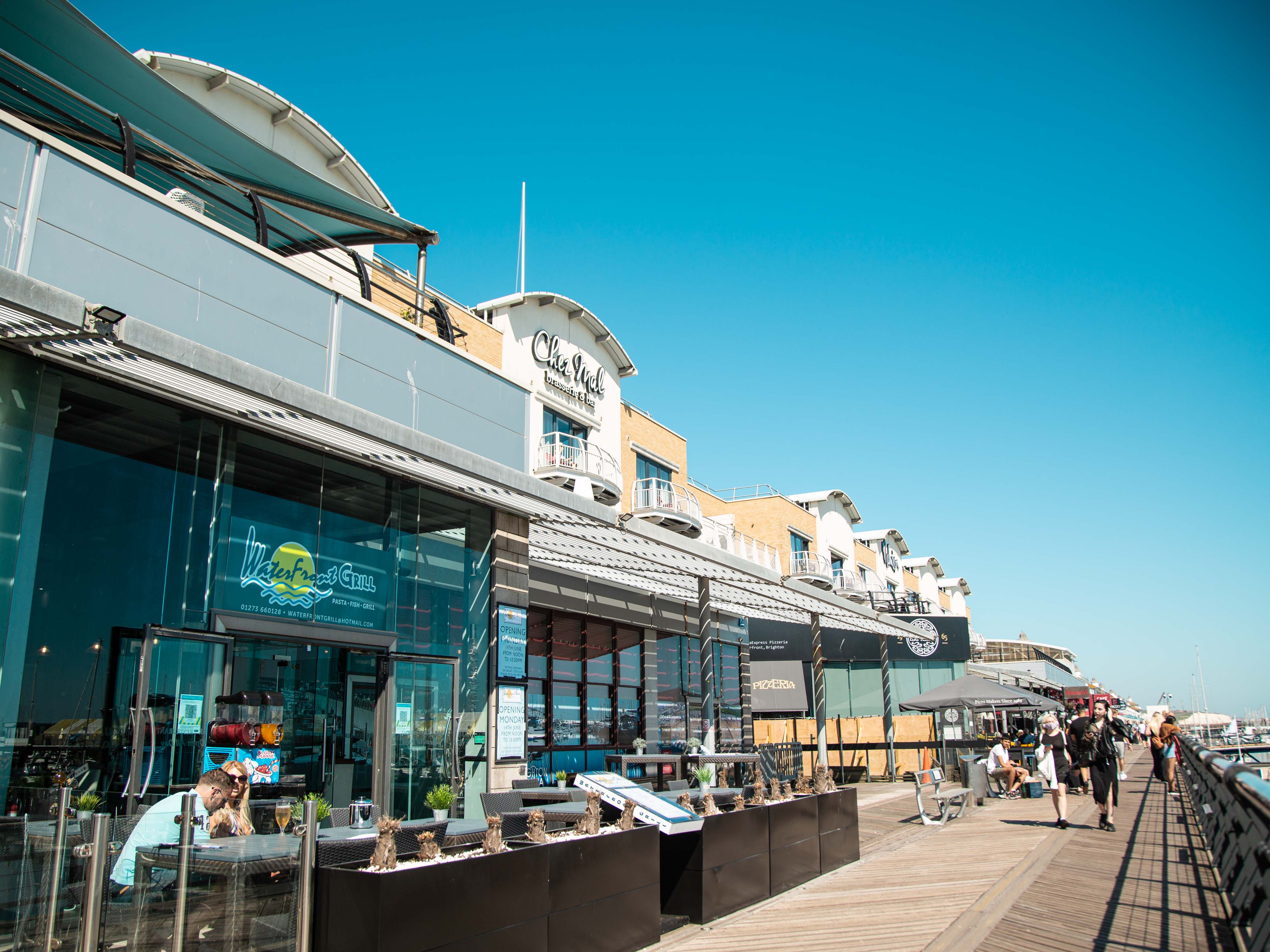 A row of shops and restaurants on Brighton's Marina