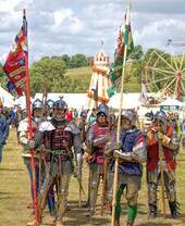 People dressed up with armours during historic reenactment