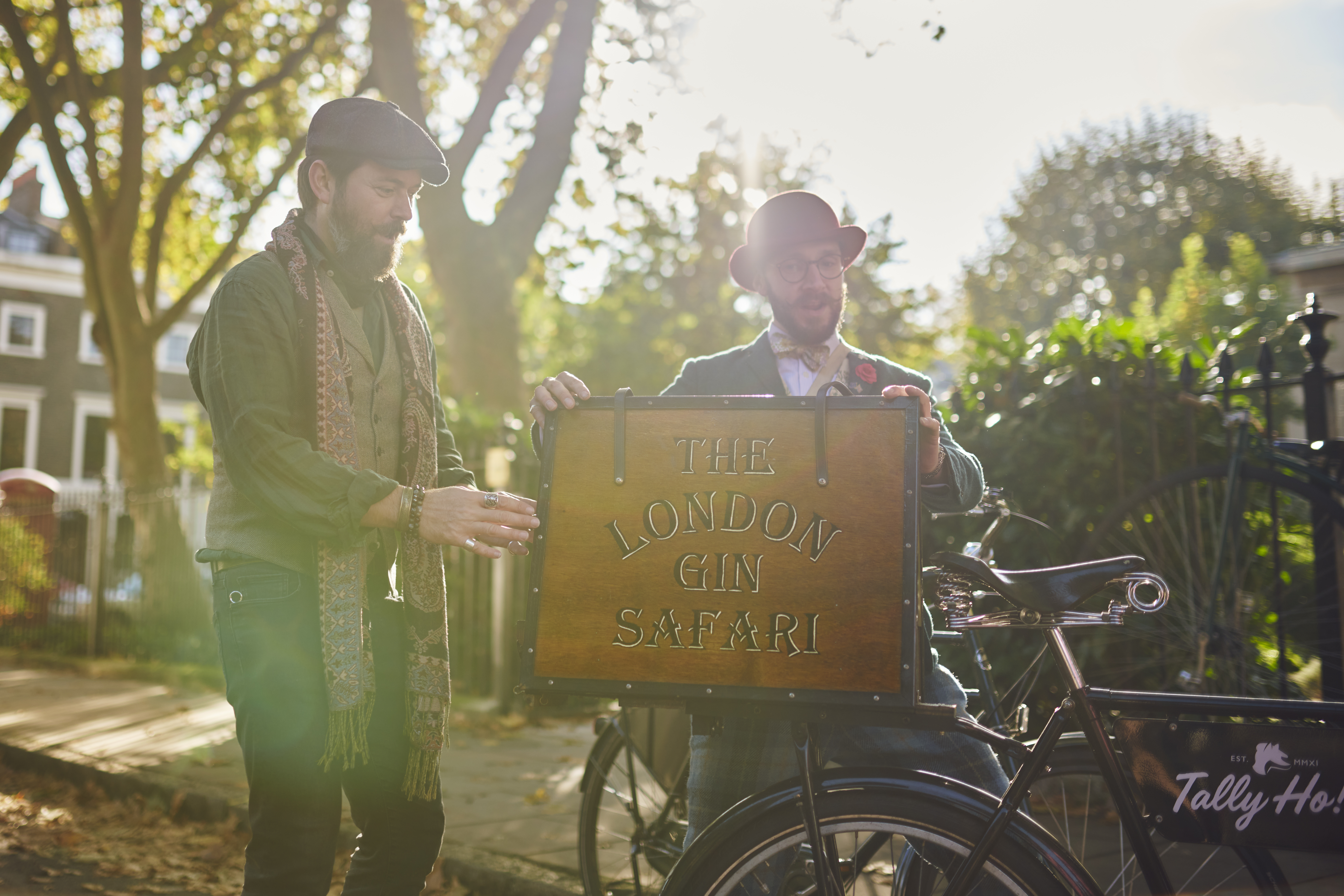 Two tour guides holding a sign in a city square for a guided tour