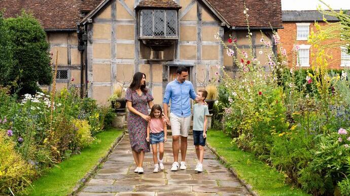 A family walking together outside heritage building