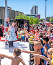 Performers on an outdoor stage at the Bradford Literature Festival