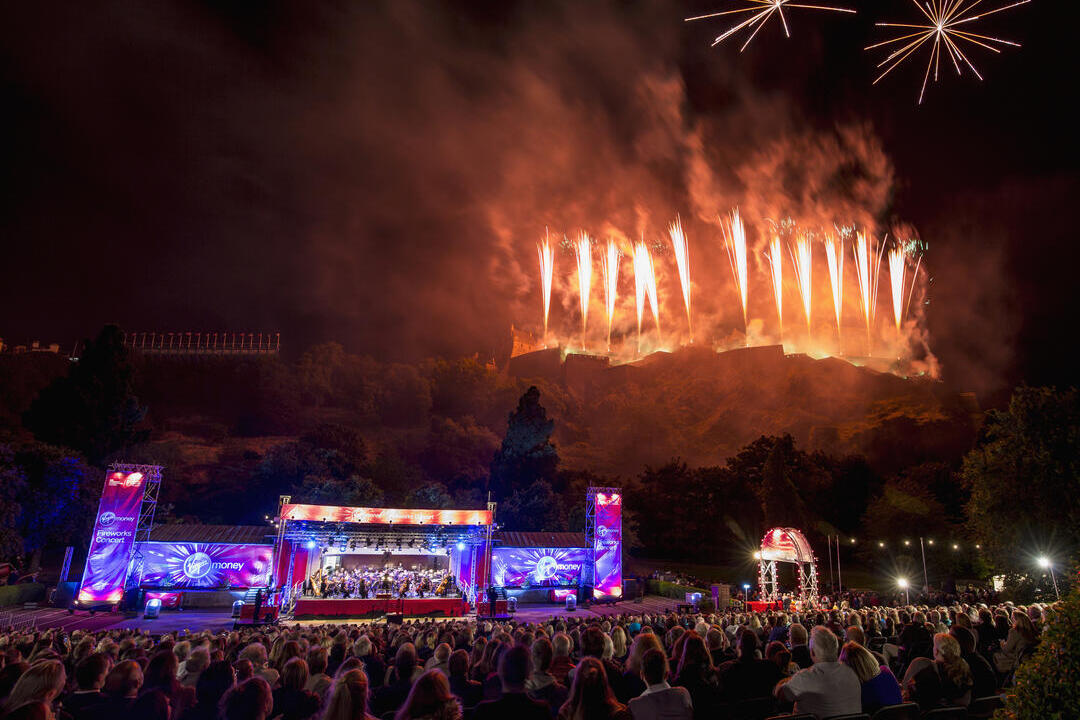 View of main stage at Edinburgh's Hogmanay event, with pyro displays in the background