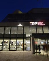 An outdoor nighttime view of the Theatre Royal Plymouth