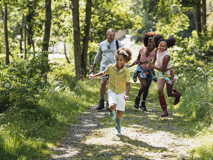 A shot of a family walking in the countryside.