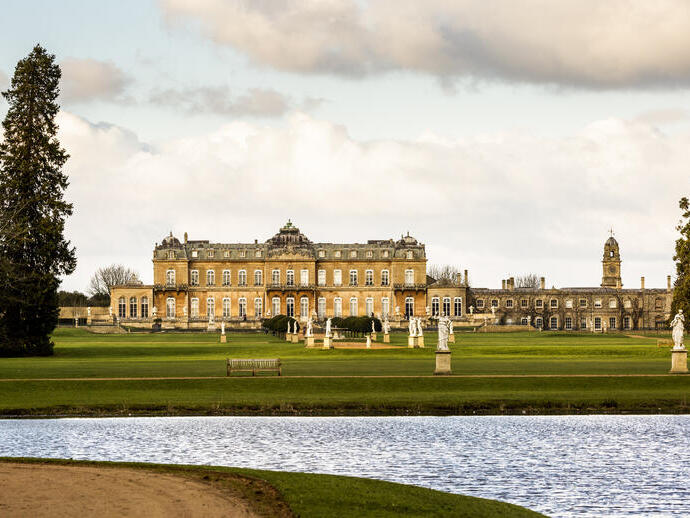 A formal Country Estate, and its lake and formal gardens and manicured lawns