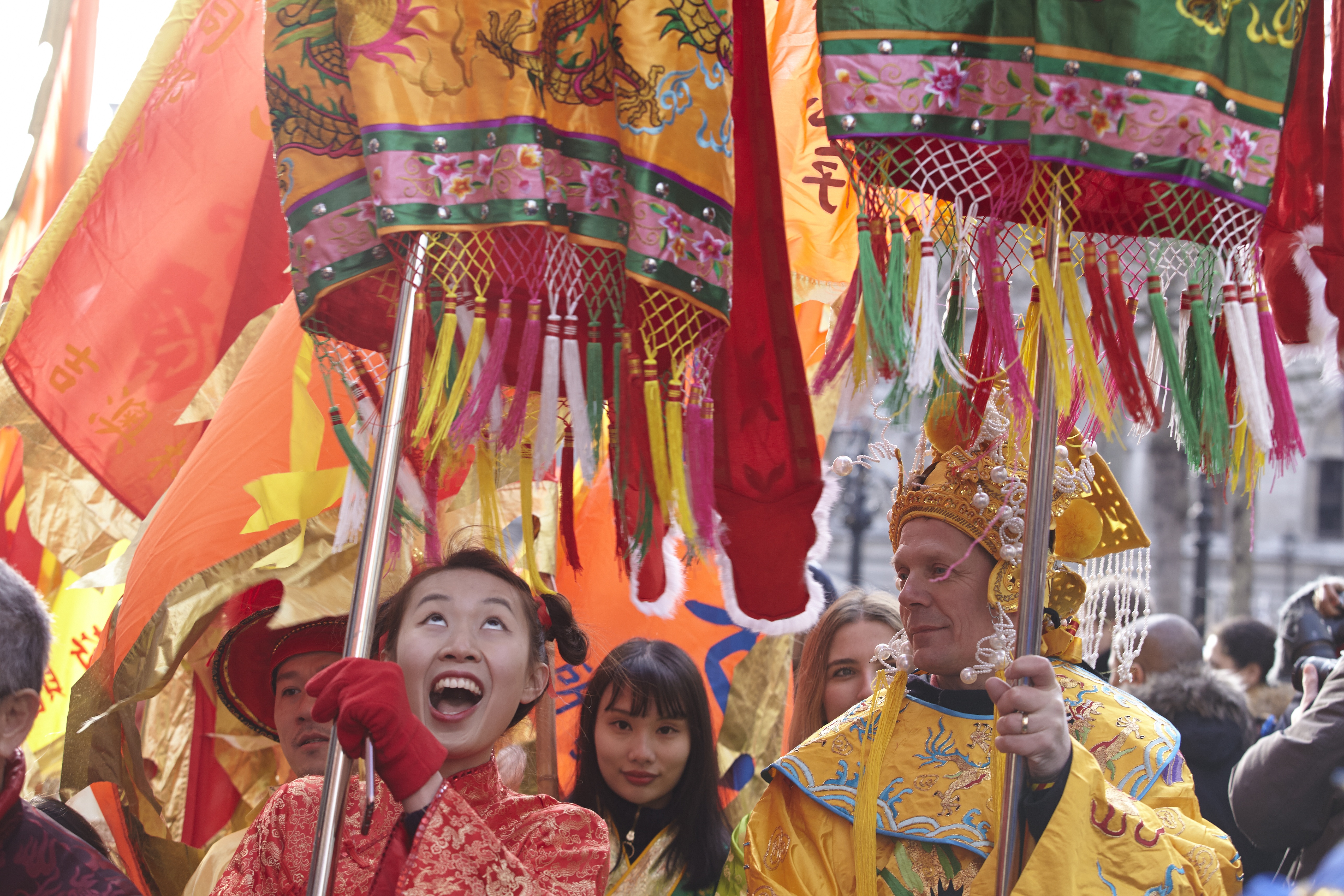 Performers in colourful Chinese costumes performing