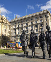 Beatles statue in a city centre.