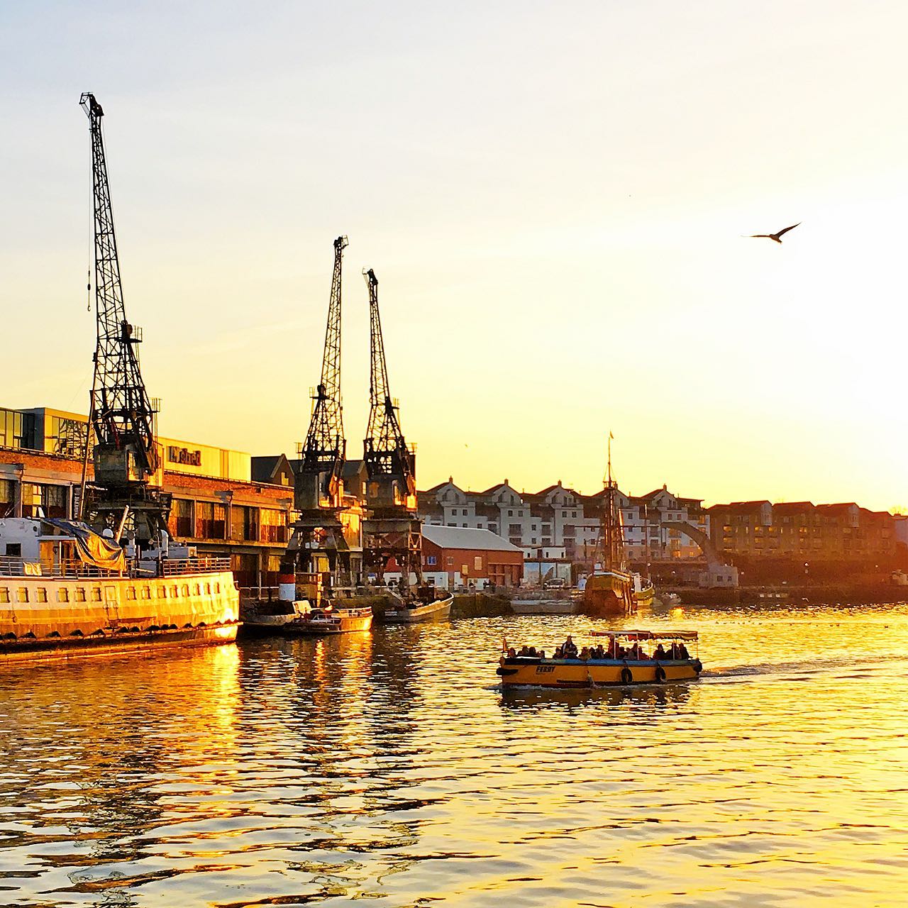 A yellow and blue Bristol Ferry on Bristol's waterways