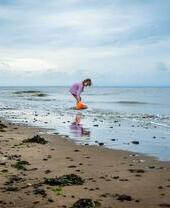 Child on the beach playing