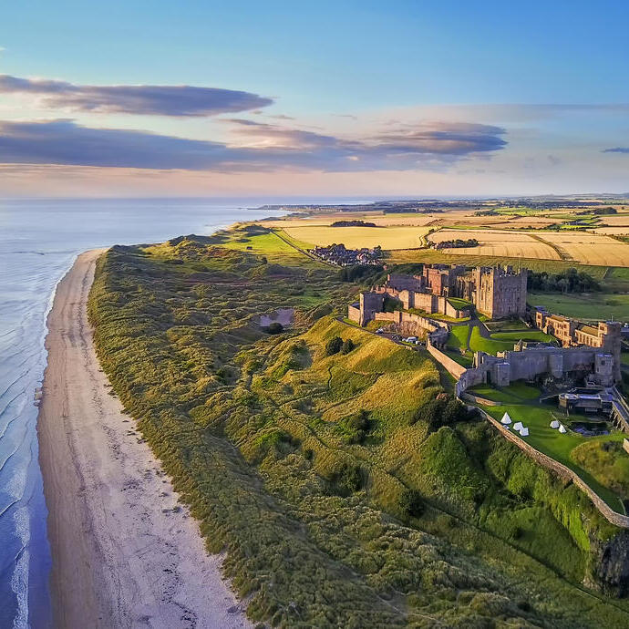 Aerial view of a large castle on the coast