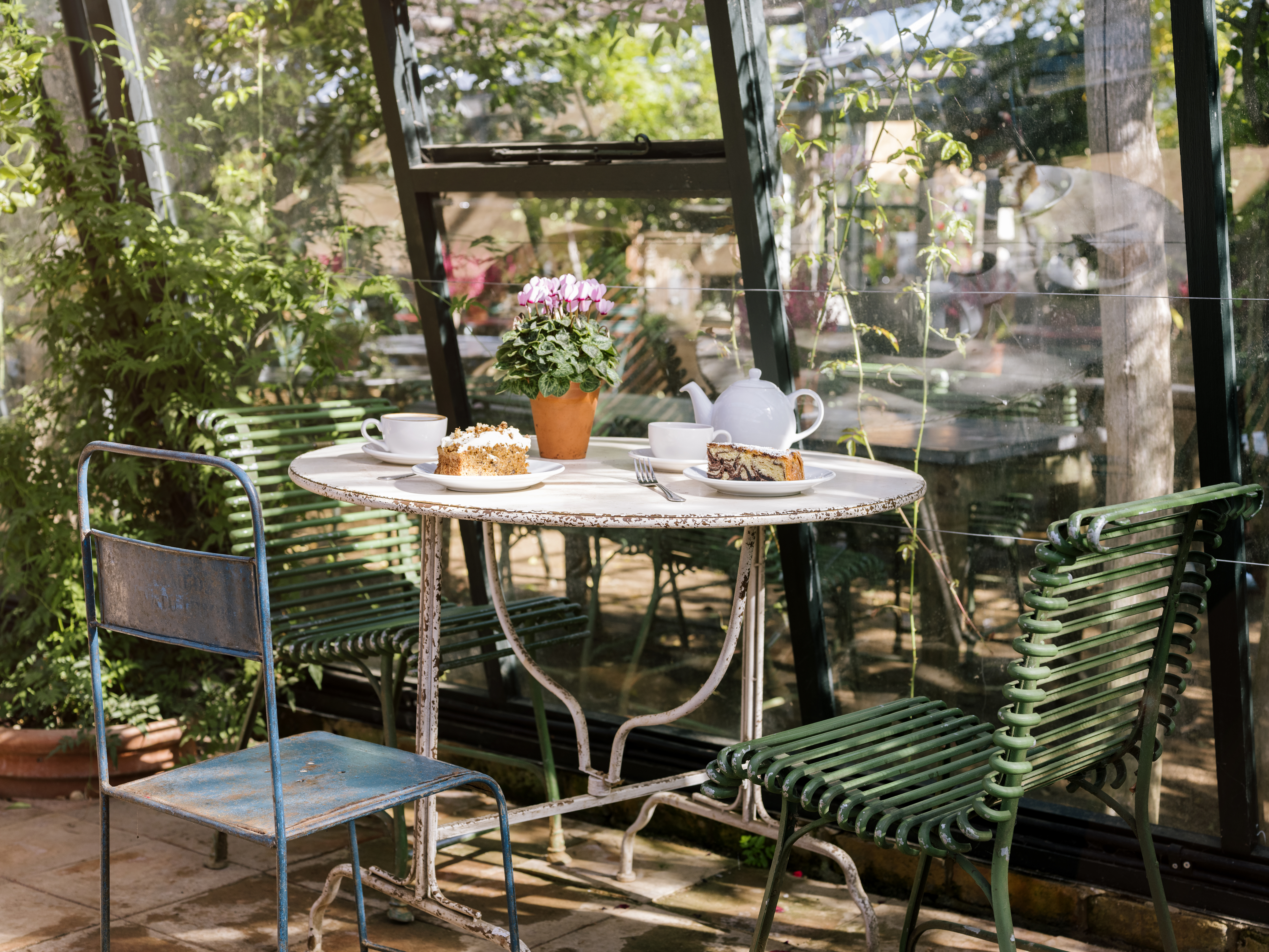 Tea and cake on a table in a garden restaurant