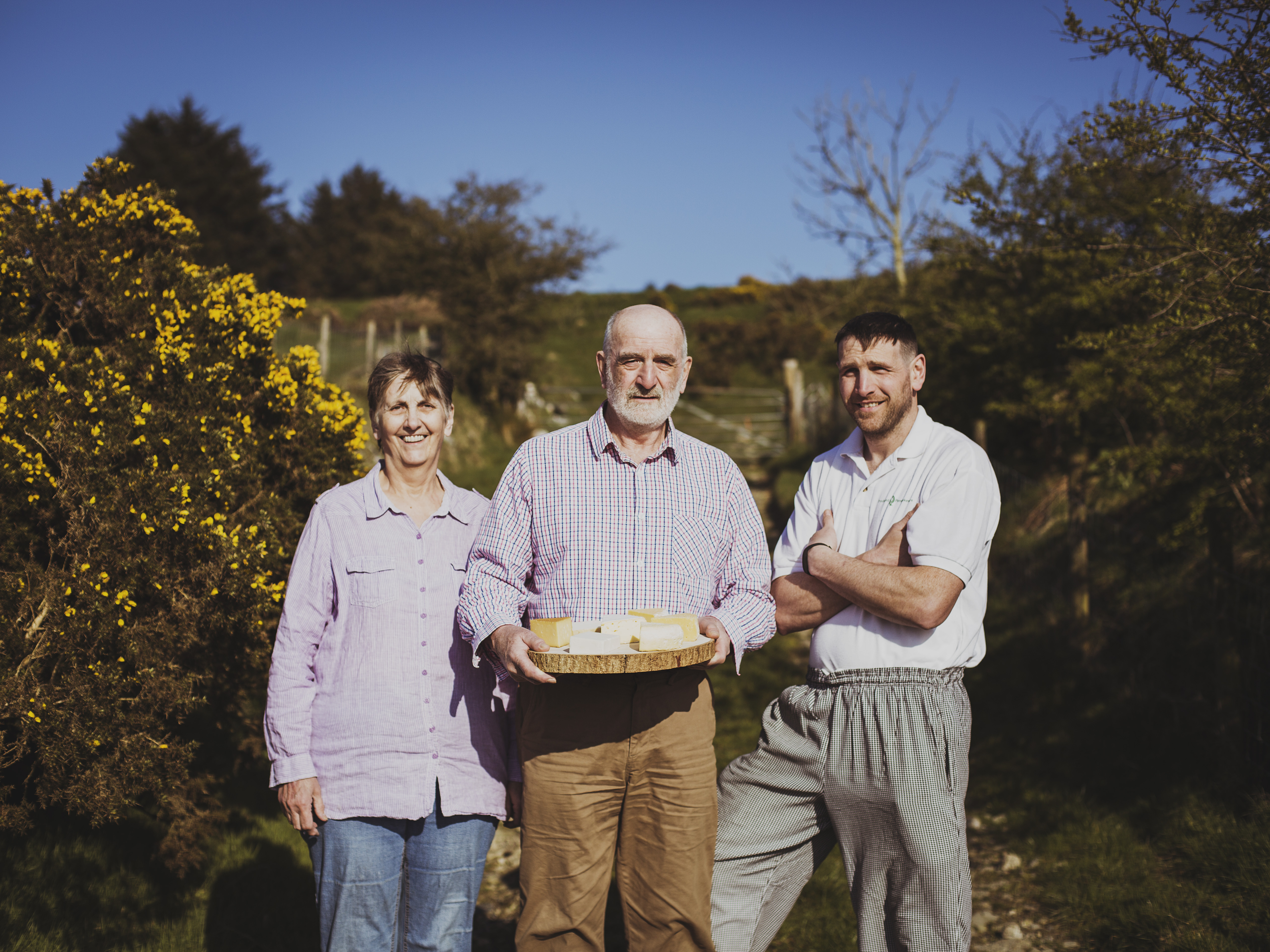 Farmers posing with fresh farmhouse cheese at Pant Mawr Farmhouse