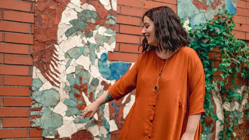 Standing infront of a mural