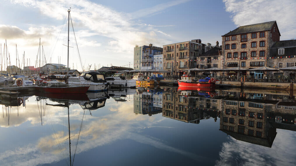 Harbour with boats and shops and cafe's