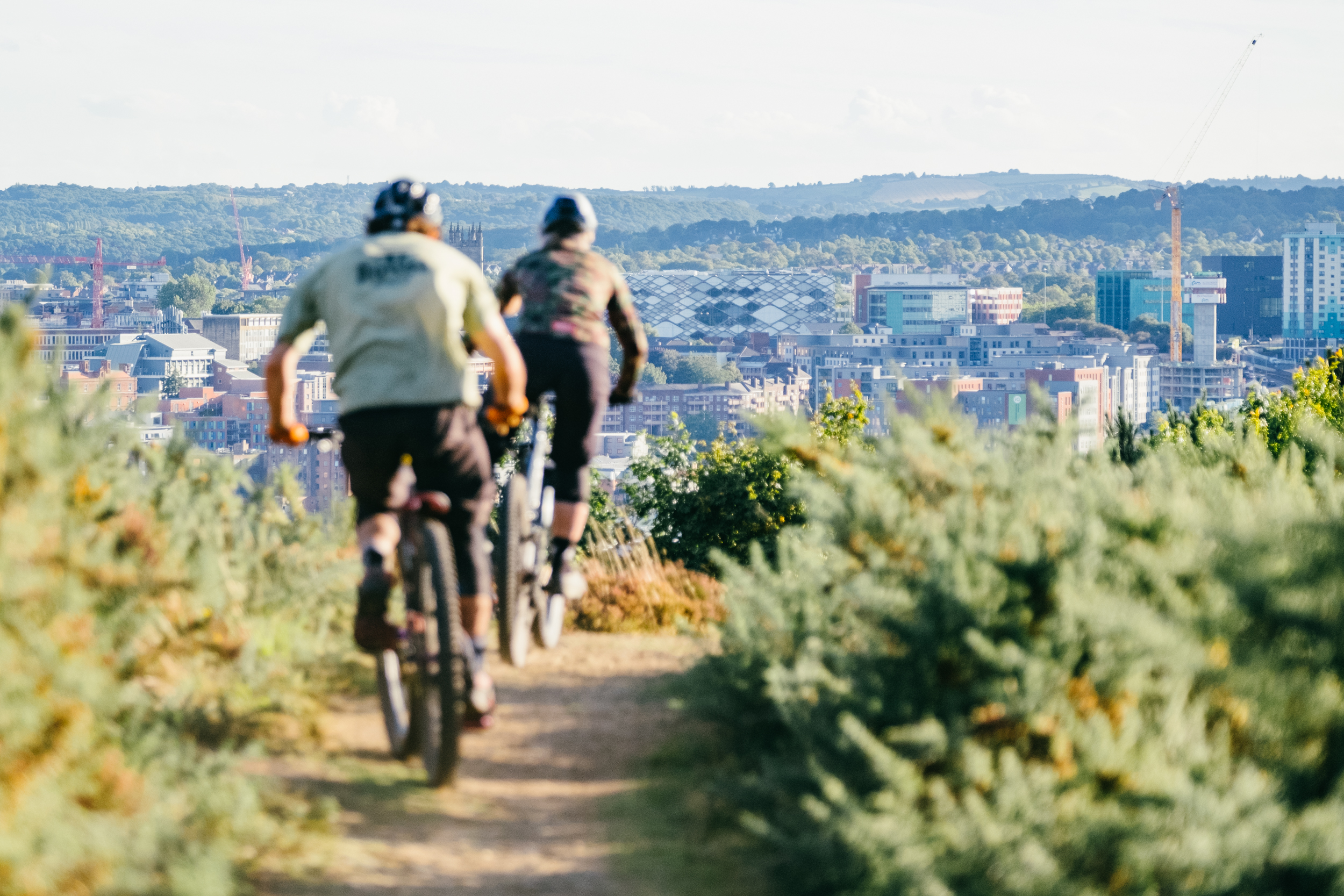 People riding bikes on the inner city mountain bike trails at Parkwood Springs, Sheffield