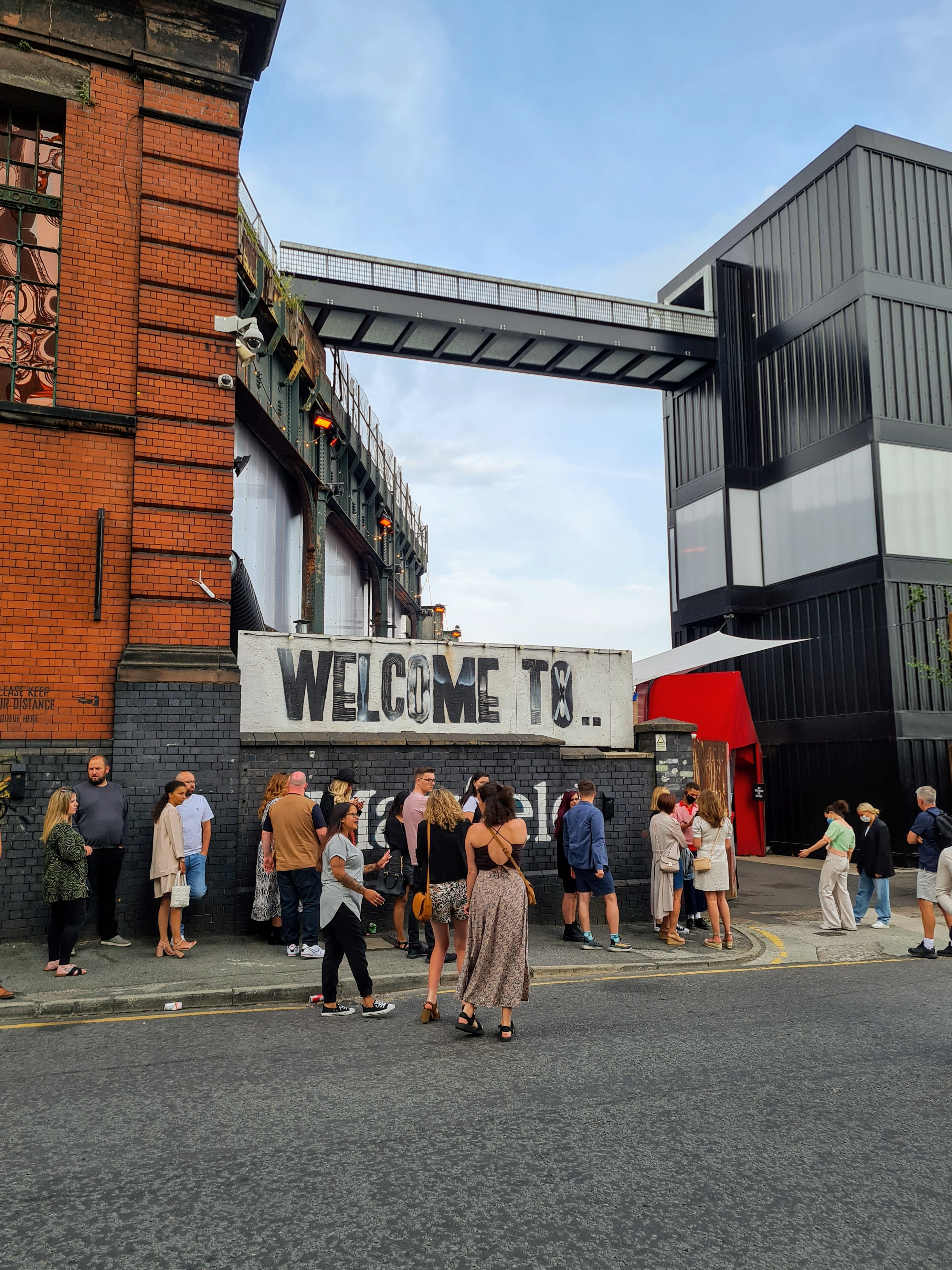 Exterior of an outdoor industrial style food hall.