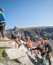 A group of people climbing up Honister Slate Mine