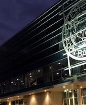 A nighttime outdoor view of the King Power Stadium, home to Leicester City Football Club