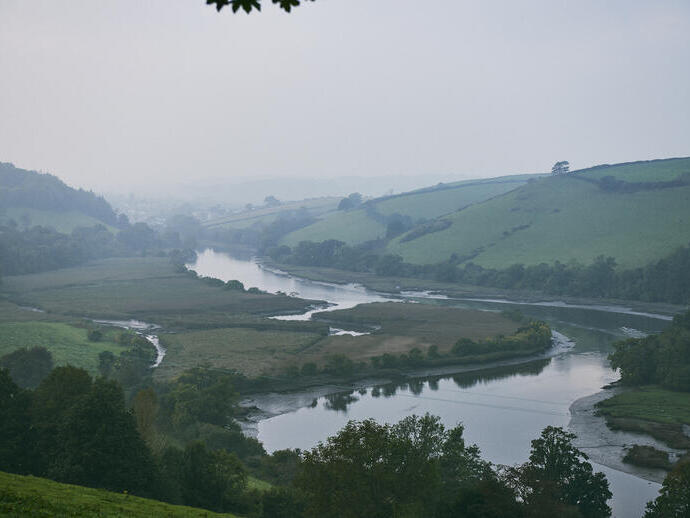 High angle landscape view of a river running through a valley.