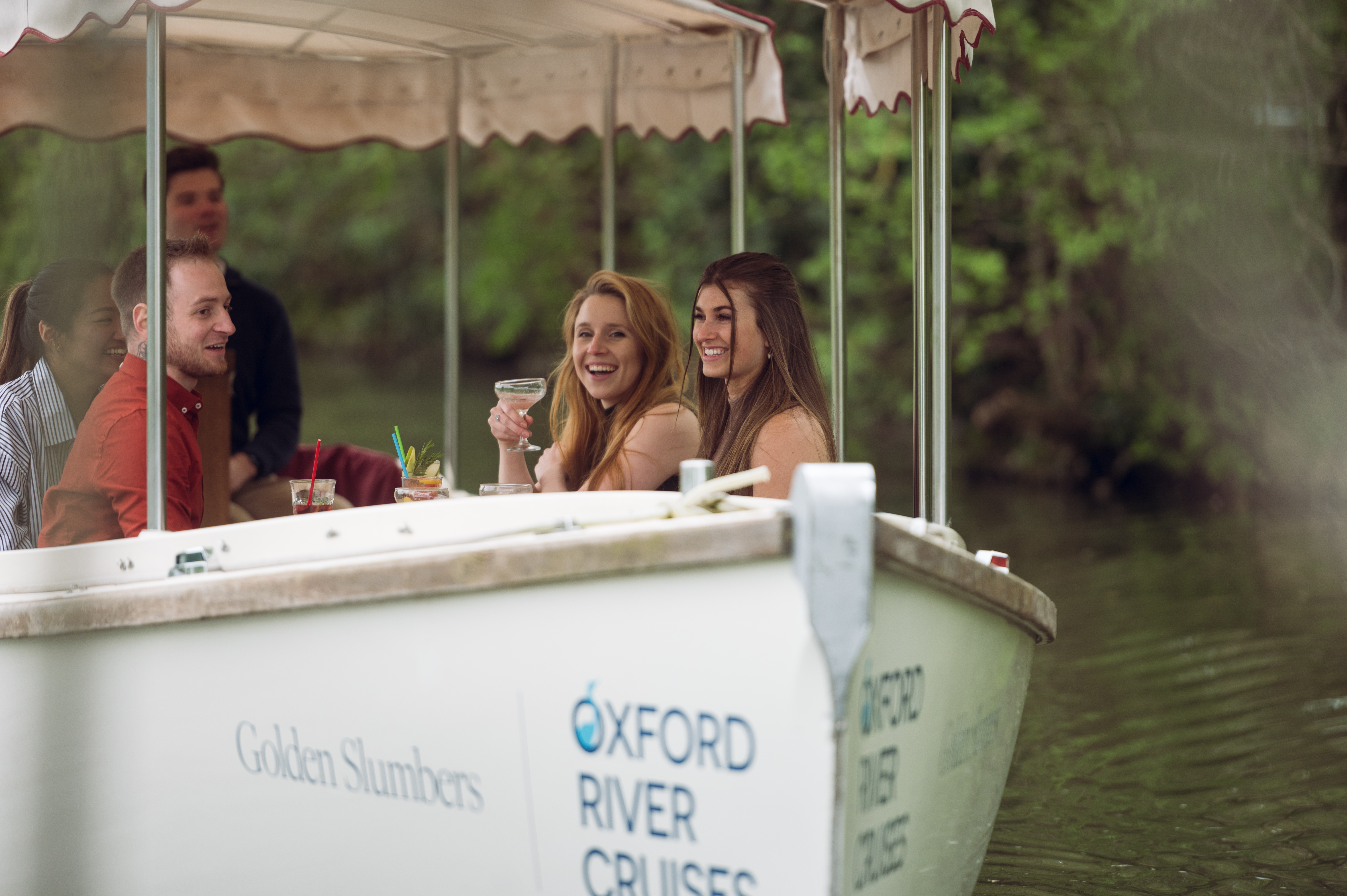 A group of people on a river boat in Oxford