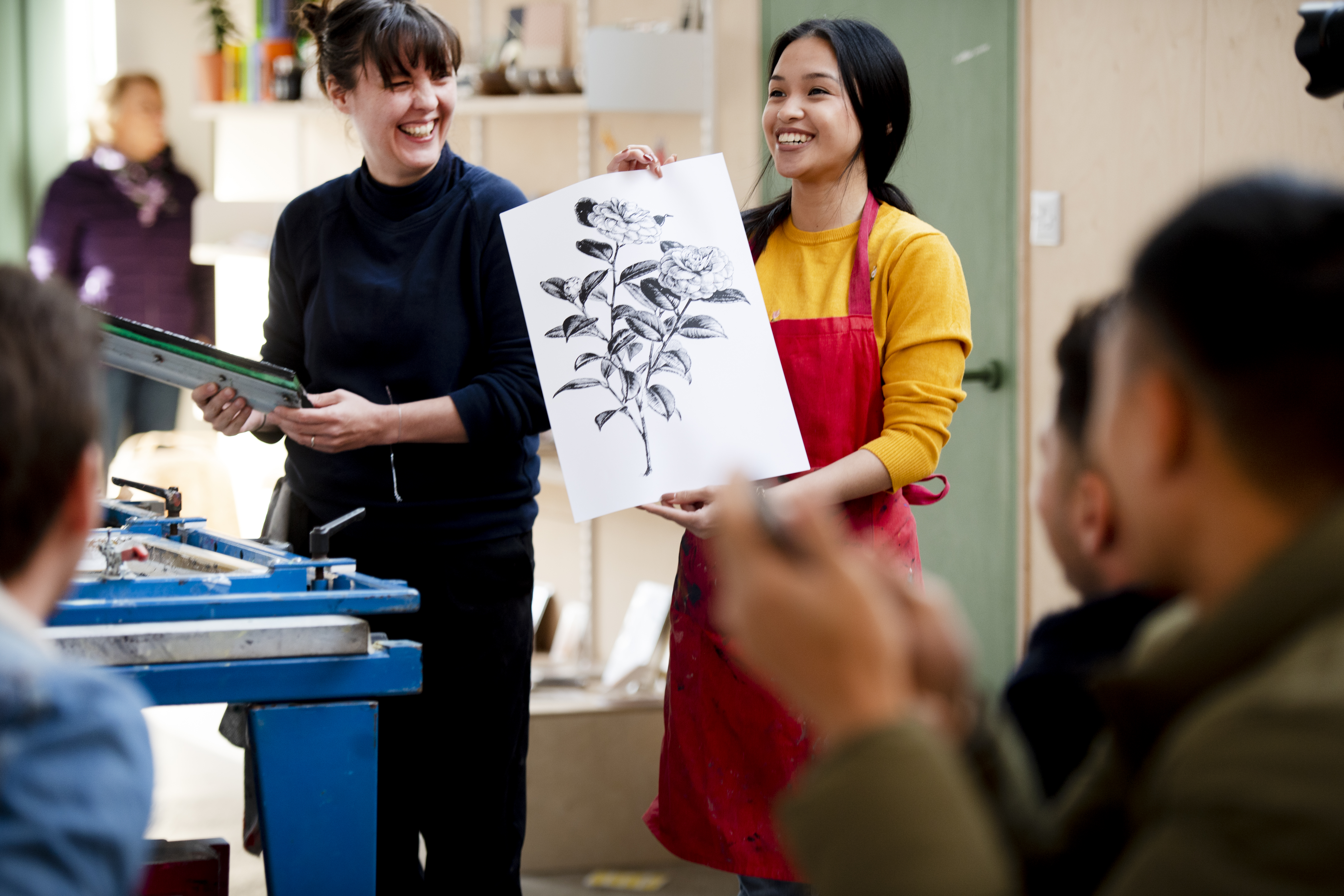 Friends in a studio attending an art workshop