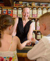 Children buying sweets from traditional sweet shop.