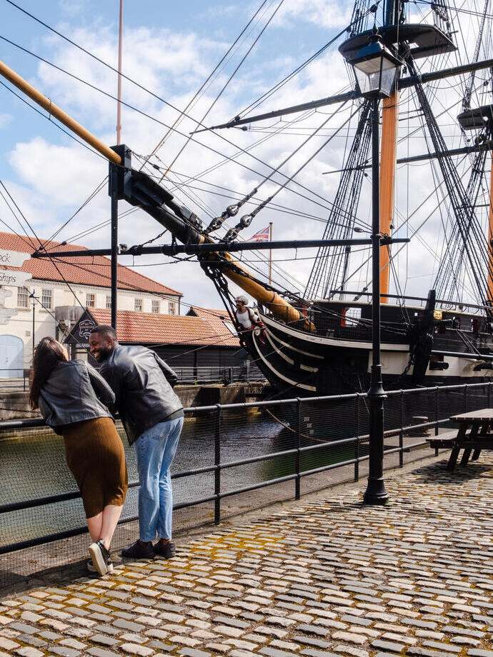 A woman and a man visiting a heritage naval museum