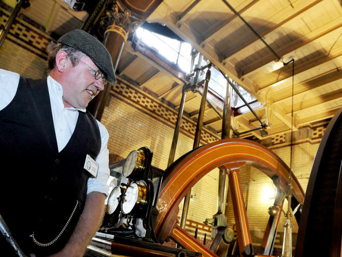 A man demonstrating machinery at Abbey Pumping Station in Leicester