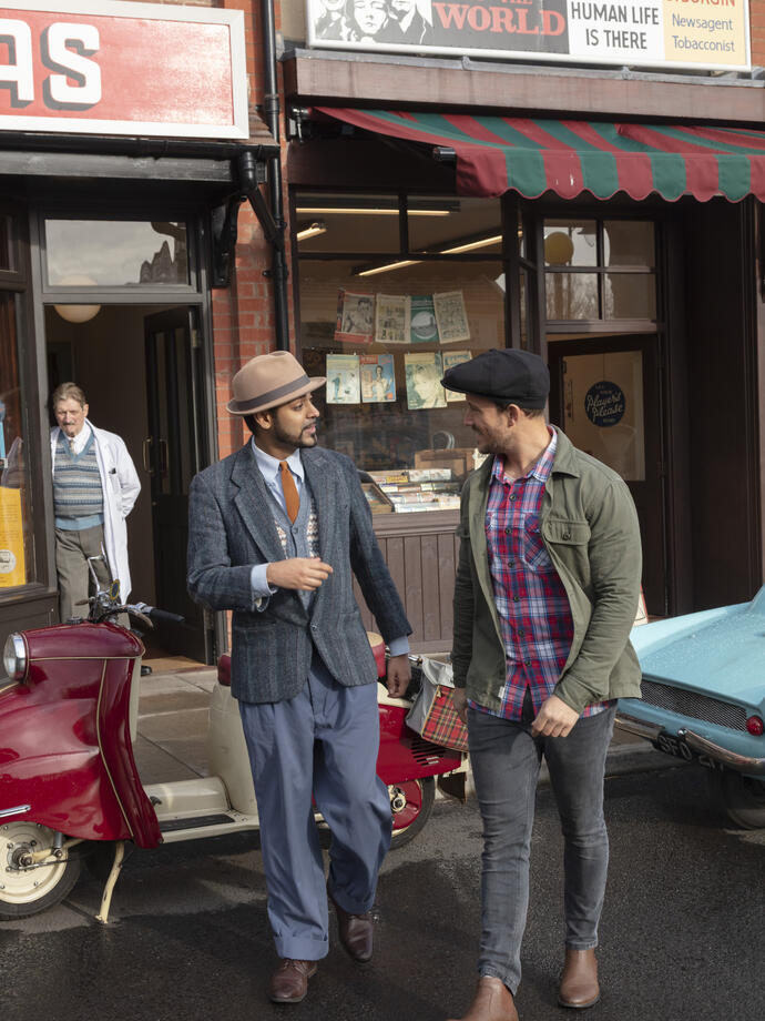 Customers talking outside an old style bookshop
