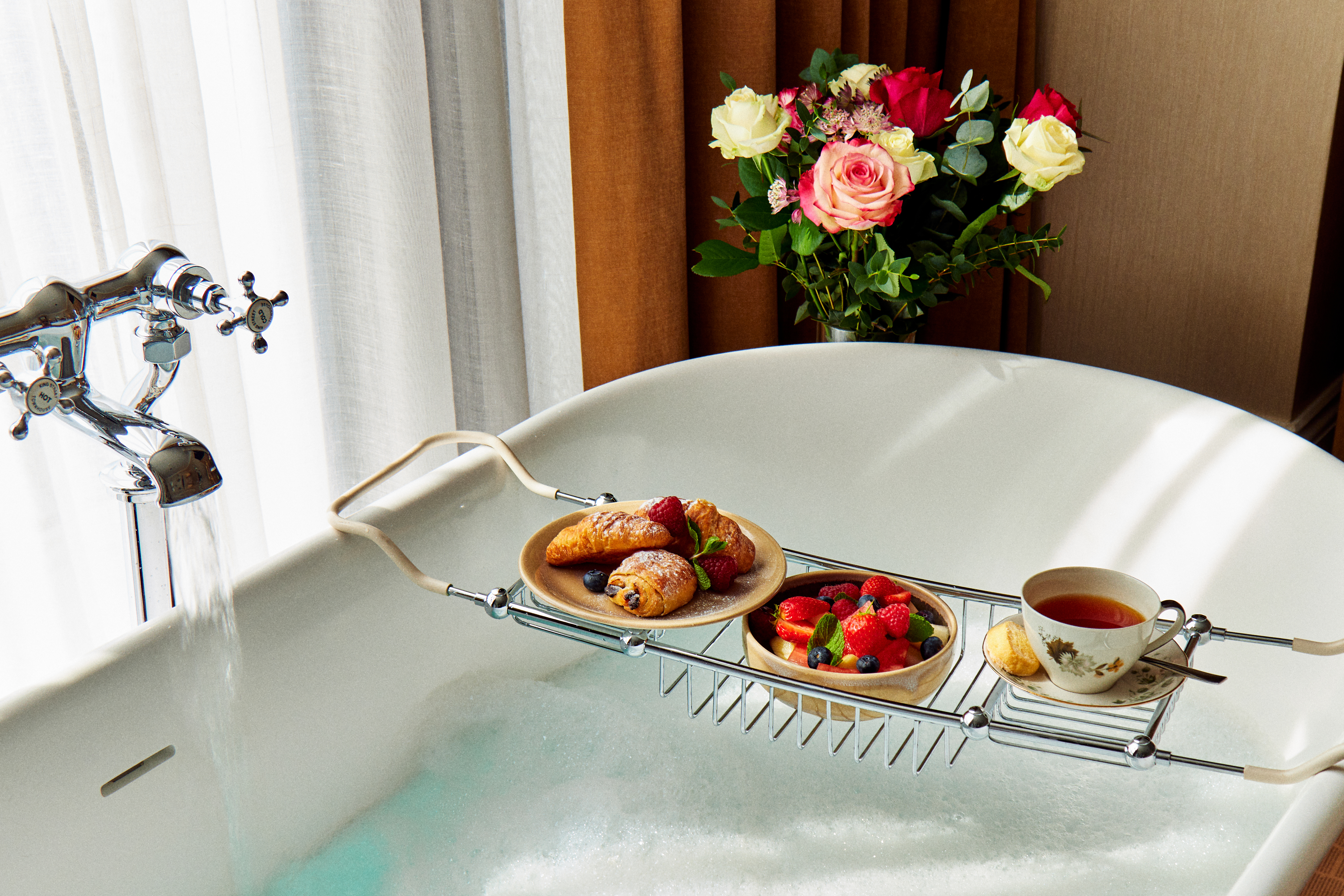 Food placed above a bath in a hotel room in Manchester's King Street Townhouse