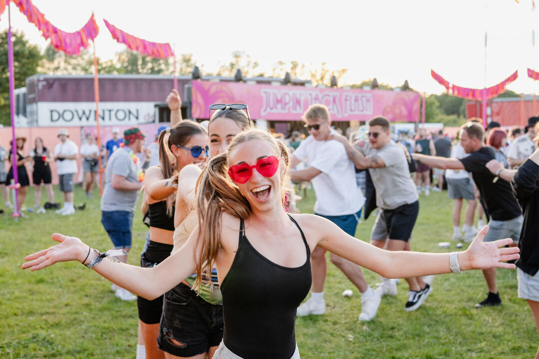 People dancing at a music festival