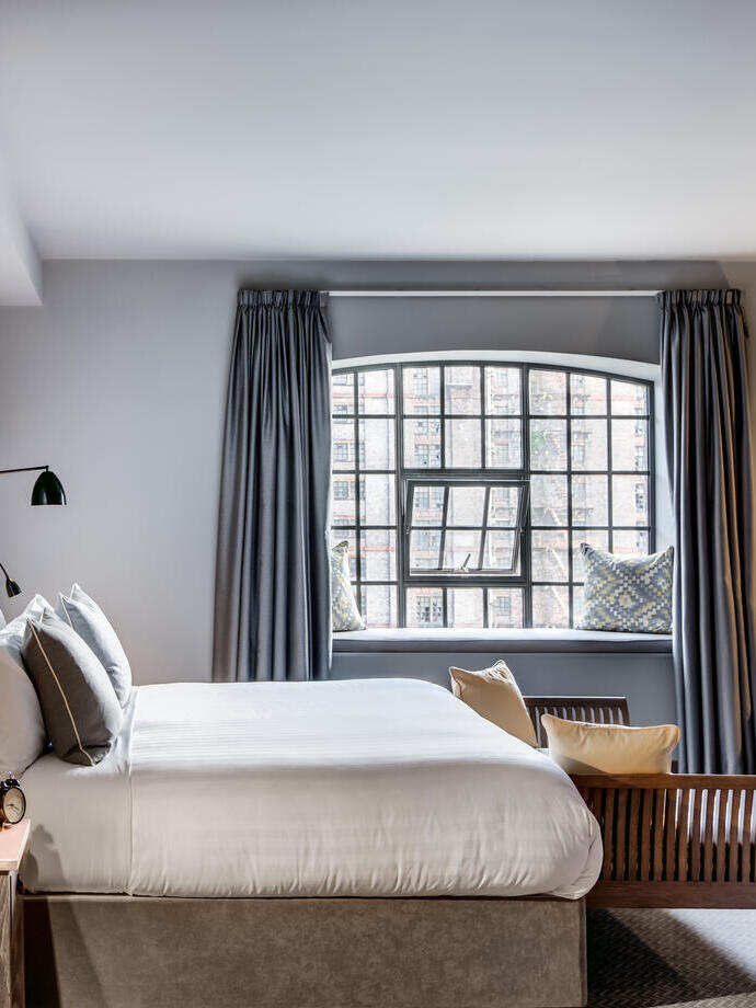 A luxury hotel room with double bed.