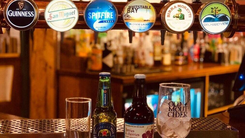Drinks on display on a pub bar