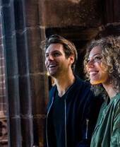 Two people touring Chester Cathedral